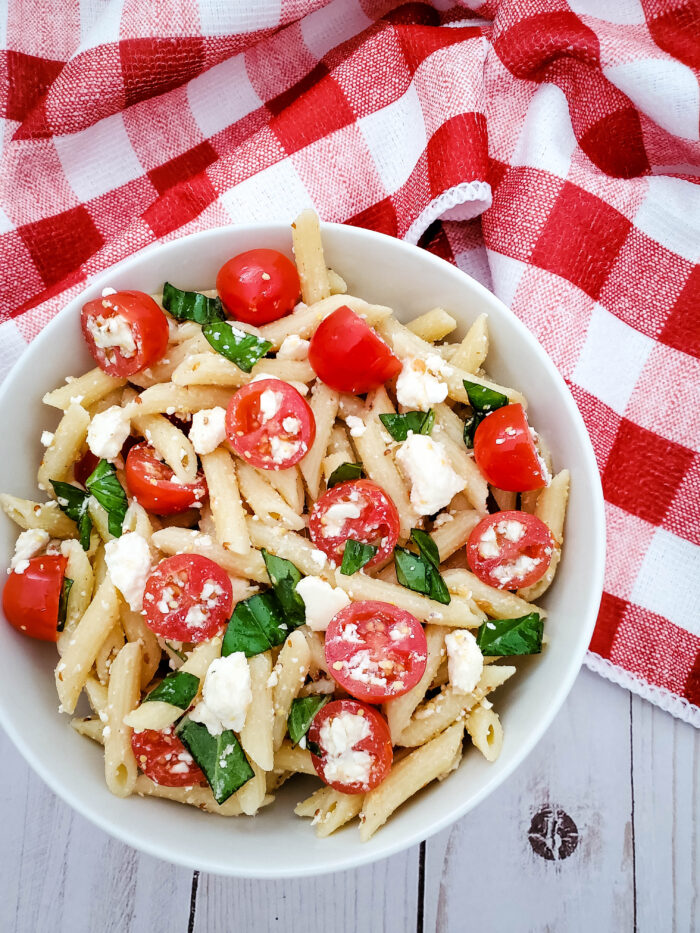 This tomato feta pasta salad is a delicious summer salad recipe, and super easy to make for a side dish or pot luck.