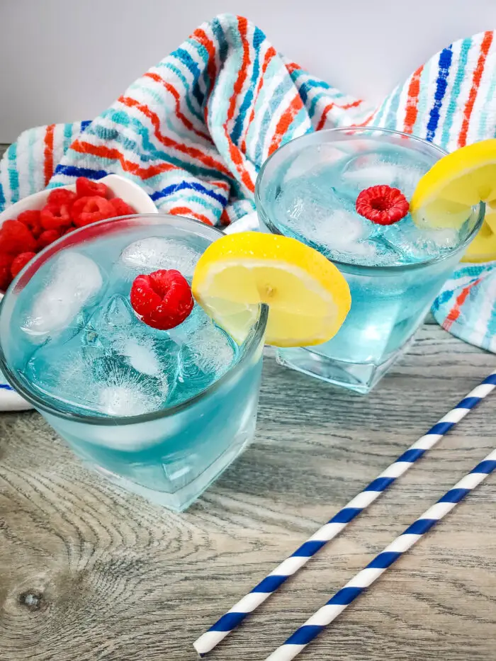 This blue island drink is one of my favorite cocktail recipes, and is super easy to make. This vodka and coconut rum cocktail is perfect for a hot summer day!