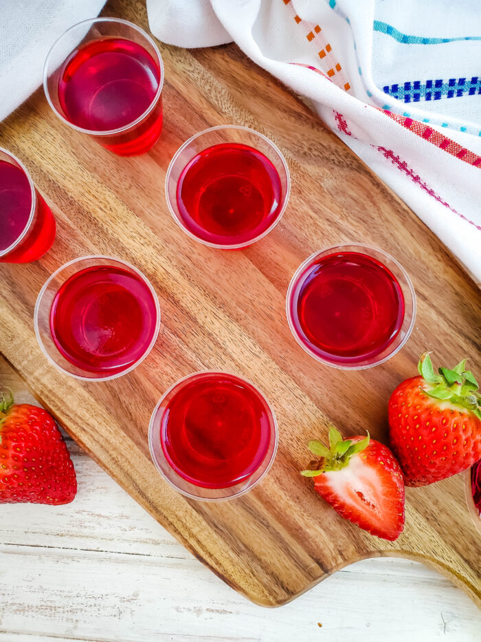 These strawberry green apple jello shots are my favorite jello shots recipe ever! The flavor combination is like no other, and they are just super simple to make!