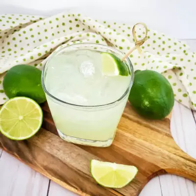 margarita with limes surrounding it